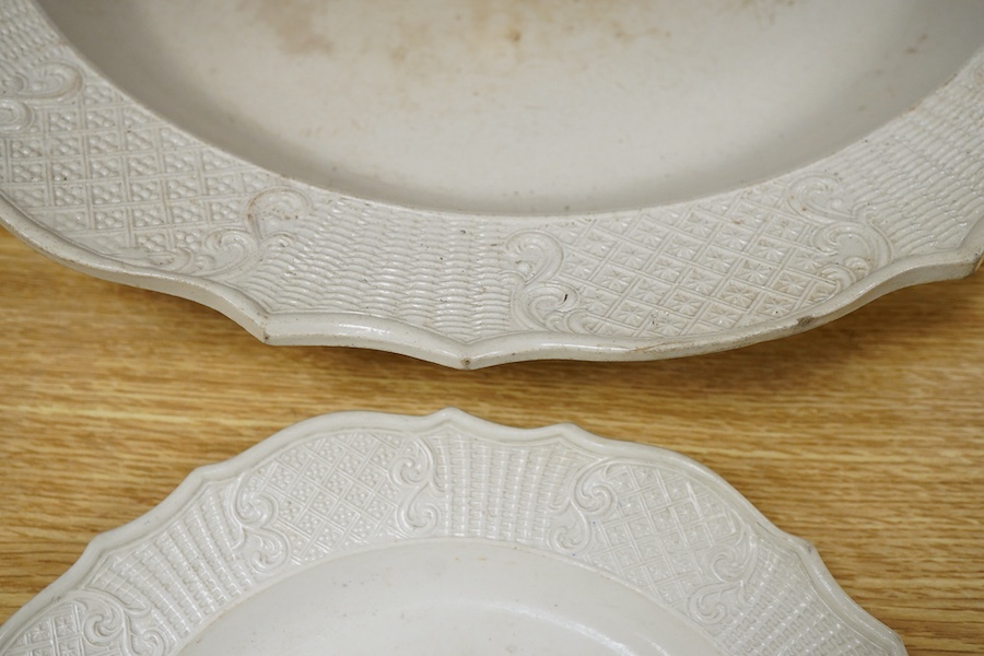 A large English salt-glazed stoneware dish and a similar plate, largest 43cm